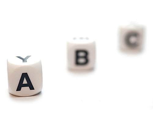 Three dice with the letters A, B and C