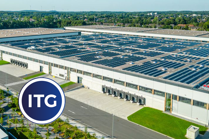 ITG logistics center with solar panels on the roof and loading docks in the foreground