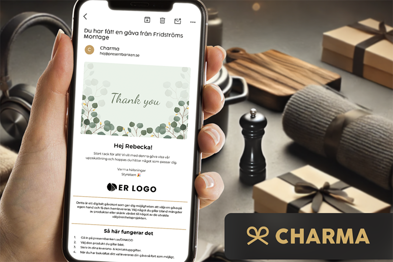 Hand holding smartphone with Charma digital gifting solution and gift message displayed