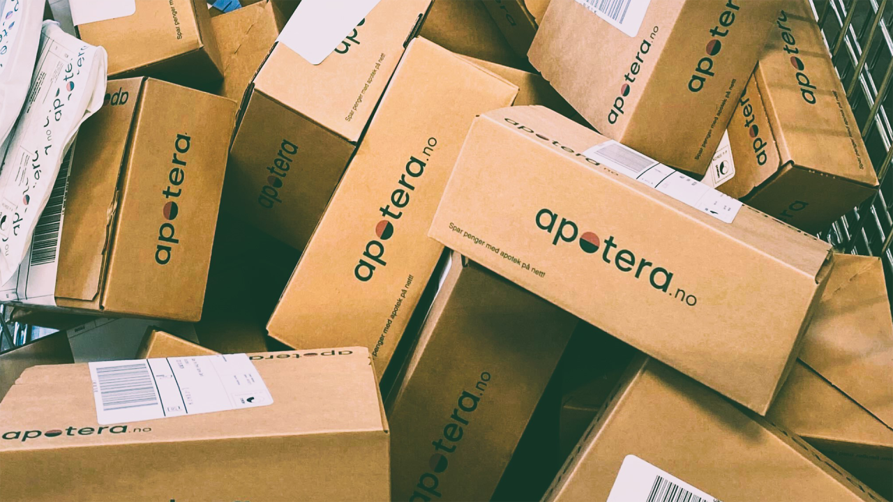 Apotera.no parcels and delivery boxes stacked for distribution