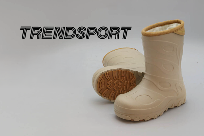 Trendsports logotyp bredvid ett par gummistövlar